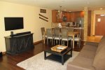 Mammoth Condo Rental Aspen Creek 117: Spacious Living Room with large smart TV, Dining Room with seating for 8